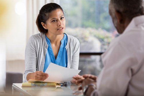 Woman speaking to her psychiatrist about things to know before starting an antidepressant.